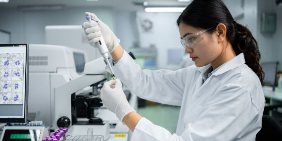 Scientist testing samples in lab